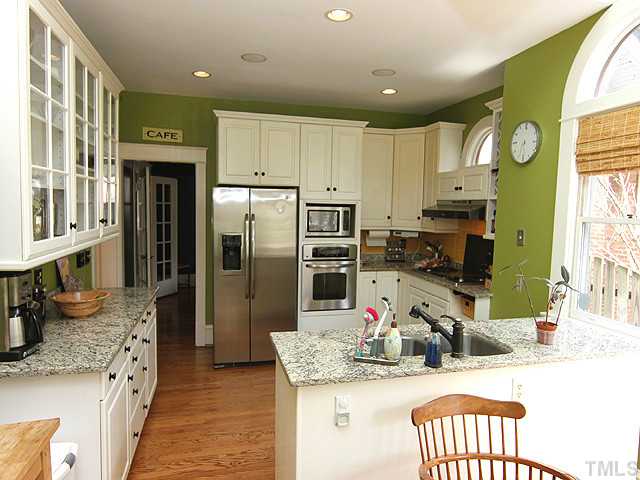 1406 Mordecai Drive Raleigh, NC 27604 - Photo 7 of 15 Beautiful Updated Kitchen with White Cabinets-Granite Counter Top-Stainless Steel Appliances - Beautiful Hardwood Floors
