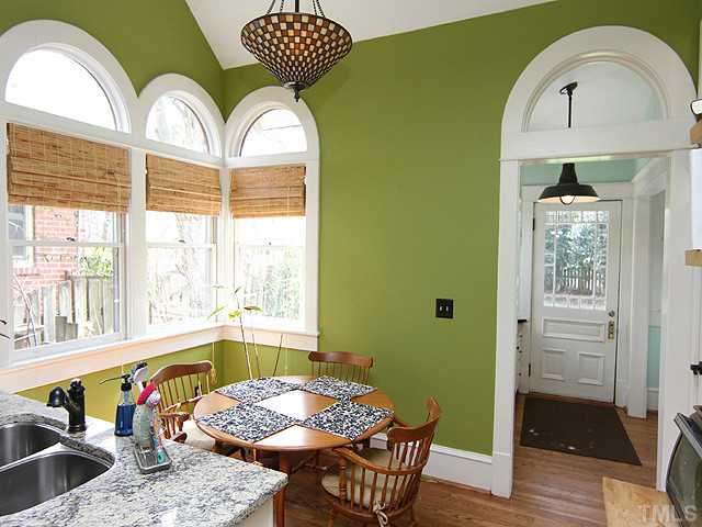 1406 Mordecai Drive Raleigh, NC 27604 - Photo 8 of 15 Open & Flowing Light Filled Room with Beautiful Windows. Vaulted Ceiling with Unique Light Fixture. Hardwood Floors - Mud Room Off Kitchen Offers Laundry Area and Built In Counter and Storage
