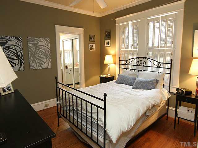 1406 Mordecai Drive Raleigh, NC 27604 - Photo 9 of 15 First Floor Master Bedroom Offers Beautiful Hardwood Floors-Smooth 9' Ceilings with Crown Molding & Ceiling Fan. Windows Offer Great Light