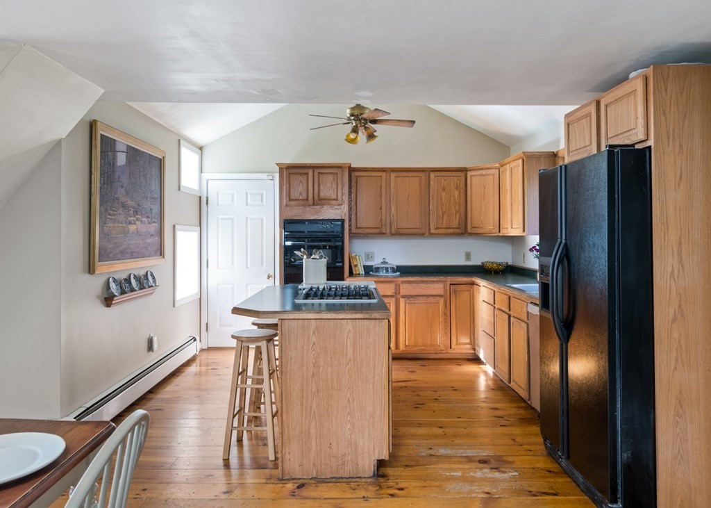 887 Broadway Hanover, MA 02339 - Photo 6 of 27 a kitchen with stainless steel appliances granite countertop a refrigerator a stove top oven a sink and dishwasher