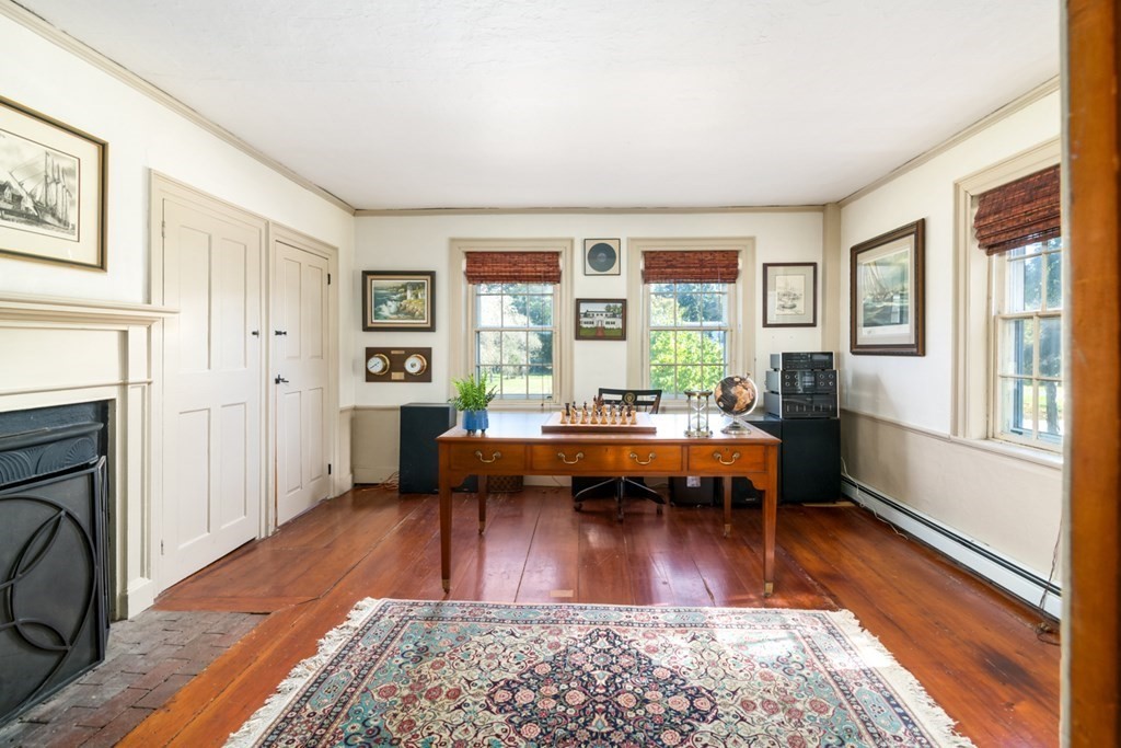 887 Broadway Hanover, MA 02339 - Photo 10 of 27 a living room with furniture a rug and a fireplace