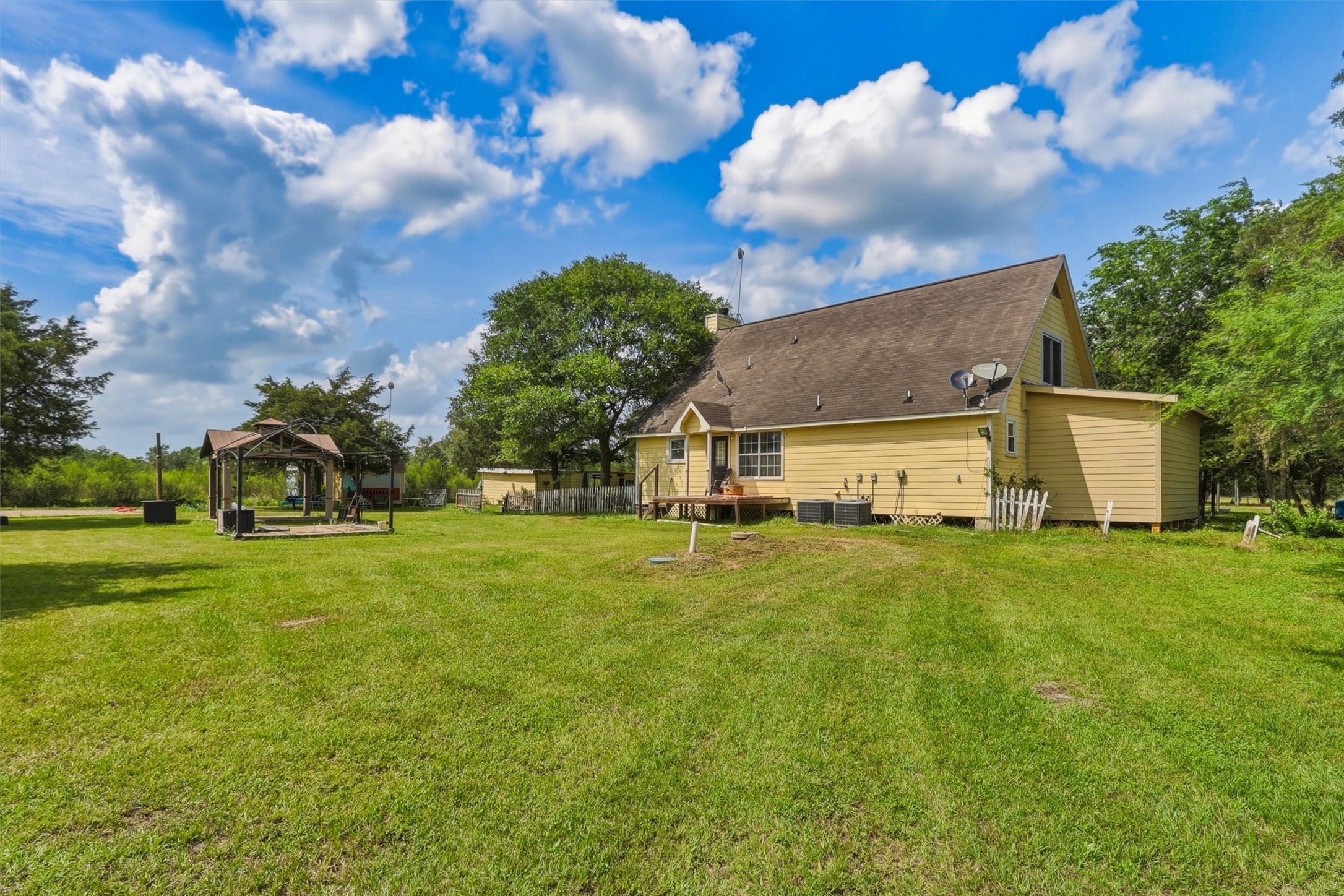 2325 Skrivanek Road Sealy, TX 77474 - Photo 28 of 36 a view of a house with a big yard and garden