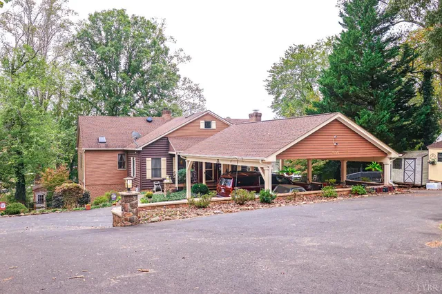 a patio area with a table and chairs under an umbrella