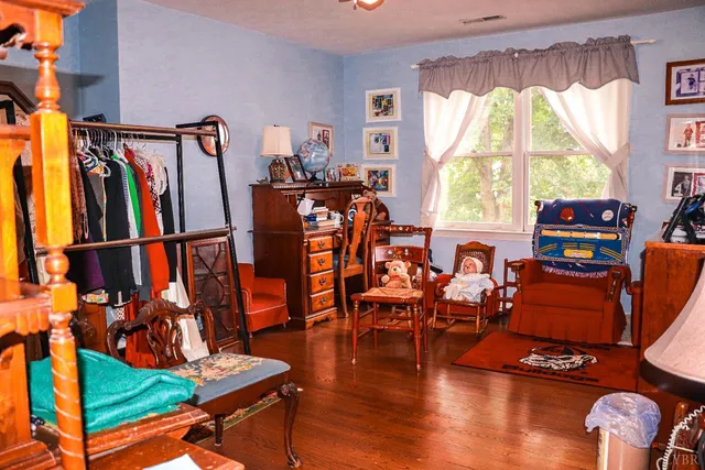 a living room with furniture a rug and a large window