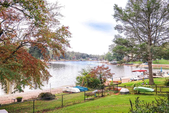 a living room filled with furniture and a large window