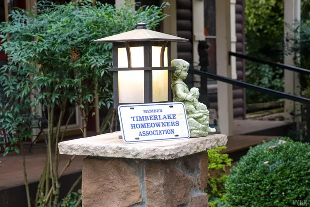 a view of house with outdoor seating and green space