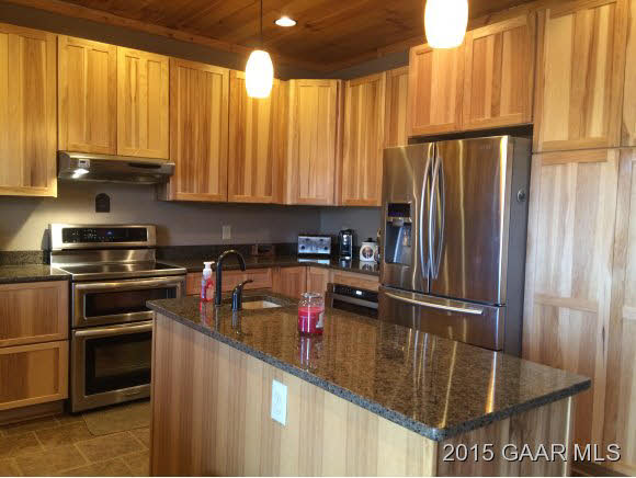 239 Howardsville Road Staunton, VA 24401 - Photo 12 of 20 a kitchen with stainless steel appliances granite countertop a refrigerator and a stove top oven