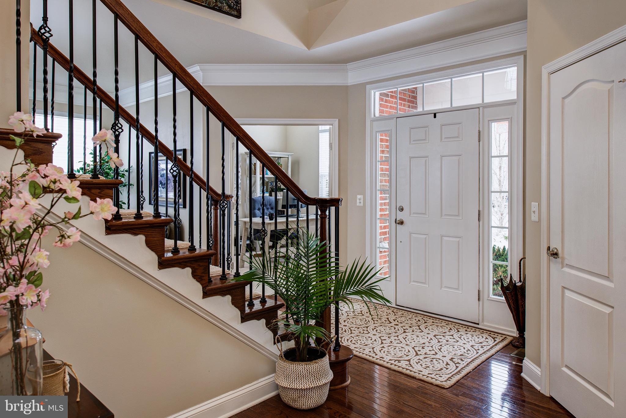 43142 Rocks Way Leesburg, VA 20176 - Photo 3 of 36 STAINED OAK STAIRCASE W/WROUGHT IRON SPINDLES