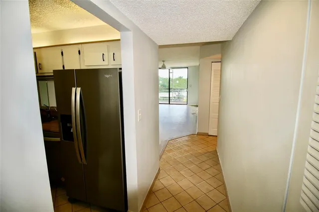 a view of hallway with wooden floor