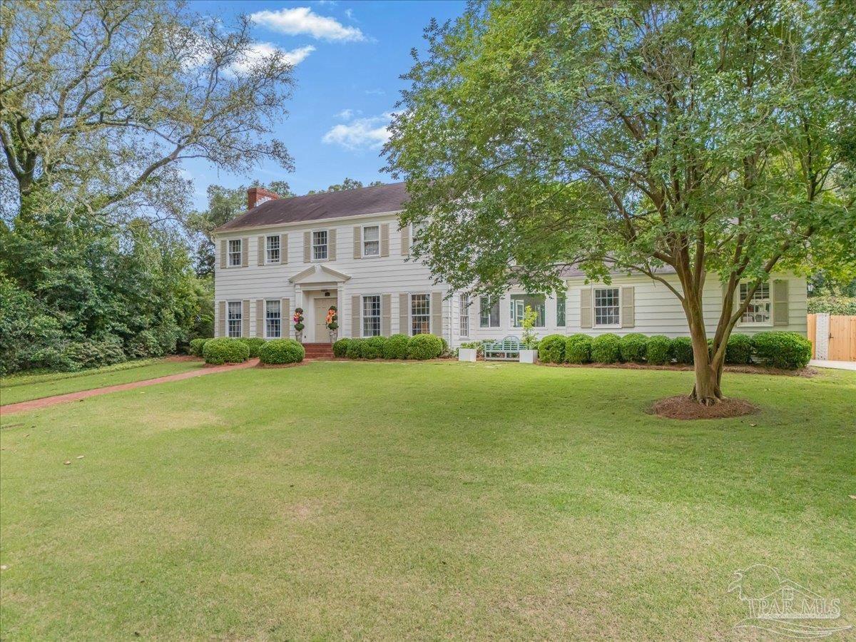 3361 Palermo Road Pensacola, FL 32503 - Photo 4 of 50 a front view of a house with a garden