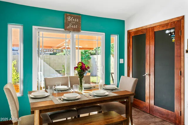 a view of a dining room with furniture window and outside view