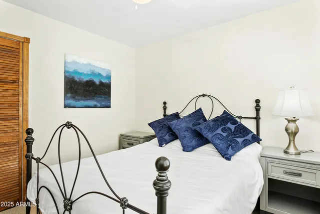 a bathroom with a granite countertop sink toilet and a mirror
