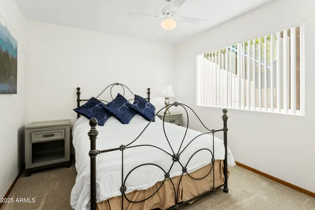 a bedroom with furniture and window