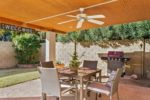 a view of swimming pool with outdoor seating