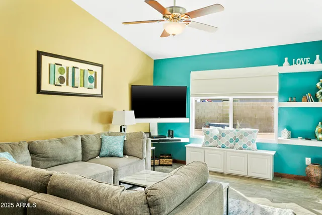 a living room with furniture and a flat screen tv