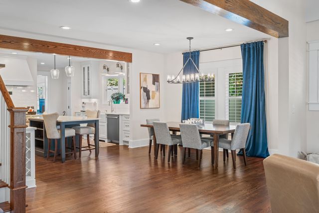 a kitchen with granite countertop stainless steel appliances and white cabinets