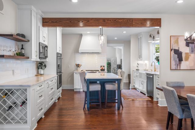 a view of dining room with furniture and wooden floor