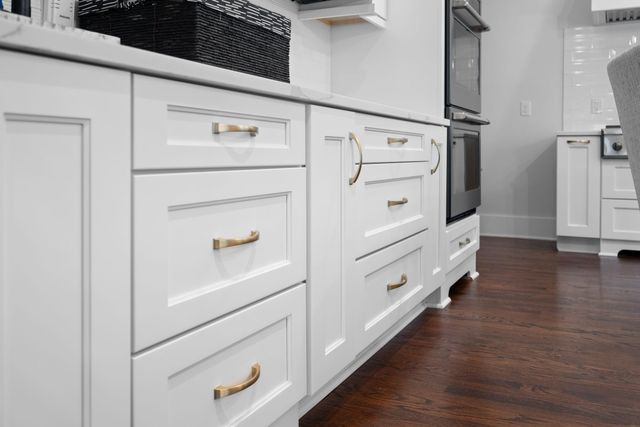 a spacious bedroom with a bed and a flat screen tv