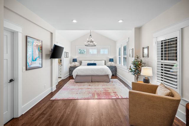 a bathroom with a granite countertop sink mirror and toilet
