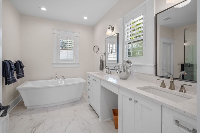 a bathroom with a toilet sink and shower