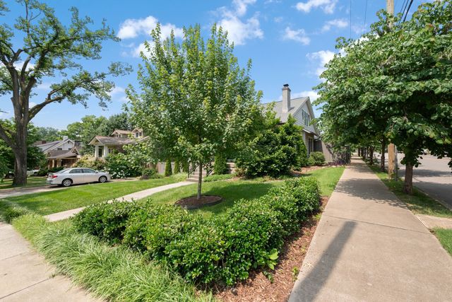 a view of living room with furniture and windows