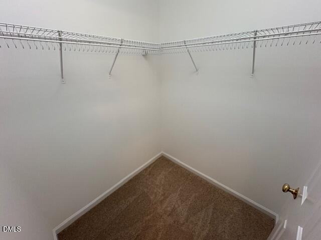 1007 Double Spring Court Apex, NC 27502 - Photo 14 of 22 a view of a room with racks on the wall