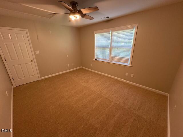 1007 Double Spring Court Apex, NC 27502 - Photo 16 of 22 an empty room with windows and fan
