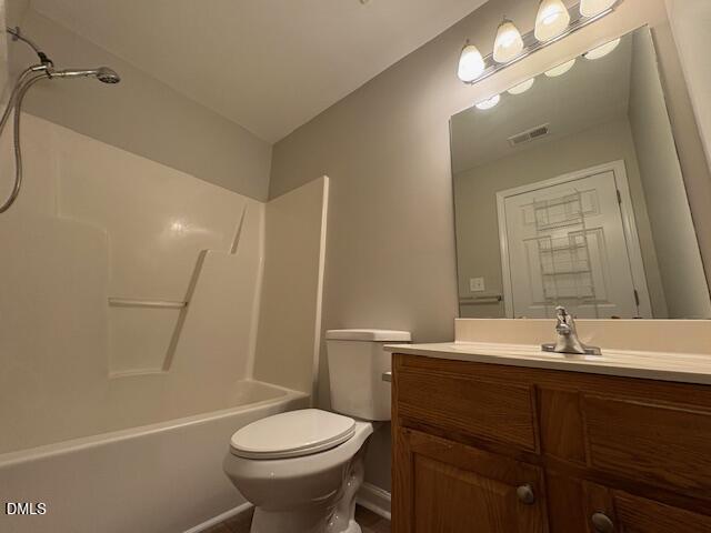 1007 Double Spring Court Apex, NC 27502 - Photo 19 of 22 a bathroom with a sink a toilet and shower