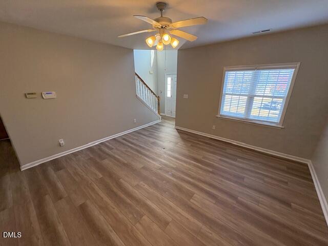 1007 Double Spring Court Apex, NC 27502 - Photo 4 of 22 wooden floor in an empty room with a window