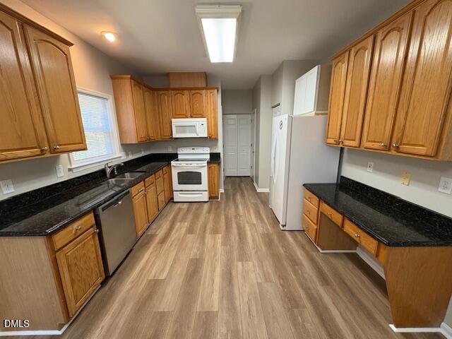 1007 Double Spring Court Apex, NC 27502 - Photo 7 of 22 a kitchen with stainless steel appliances granite countertop a stove a sink dishwasher and a refrigerator