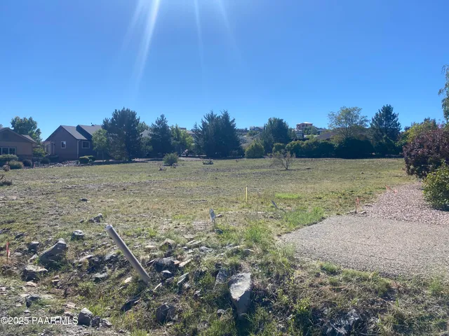 a view of a field with an ocean