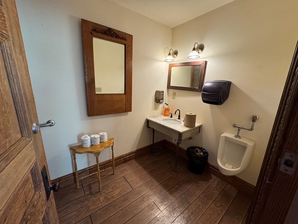 206 Seneca Street Oil City, PA 16301 - Photo 6 of 21 a bathroom with a toilet a sink and a mirror