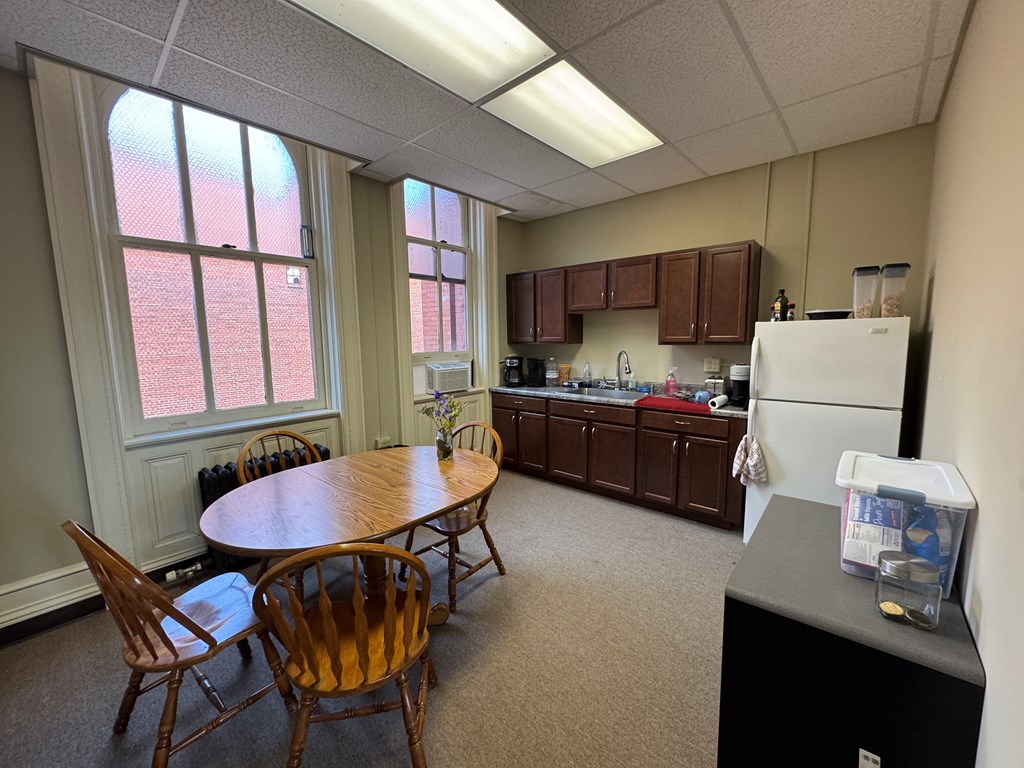 206 Seneca Street Oil City, PA 16301 - Photo 10 of 21 a kitchen with a dining table and chairs