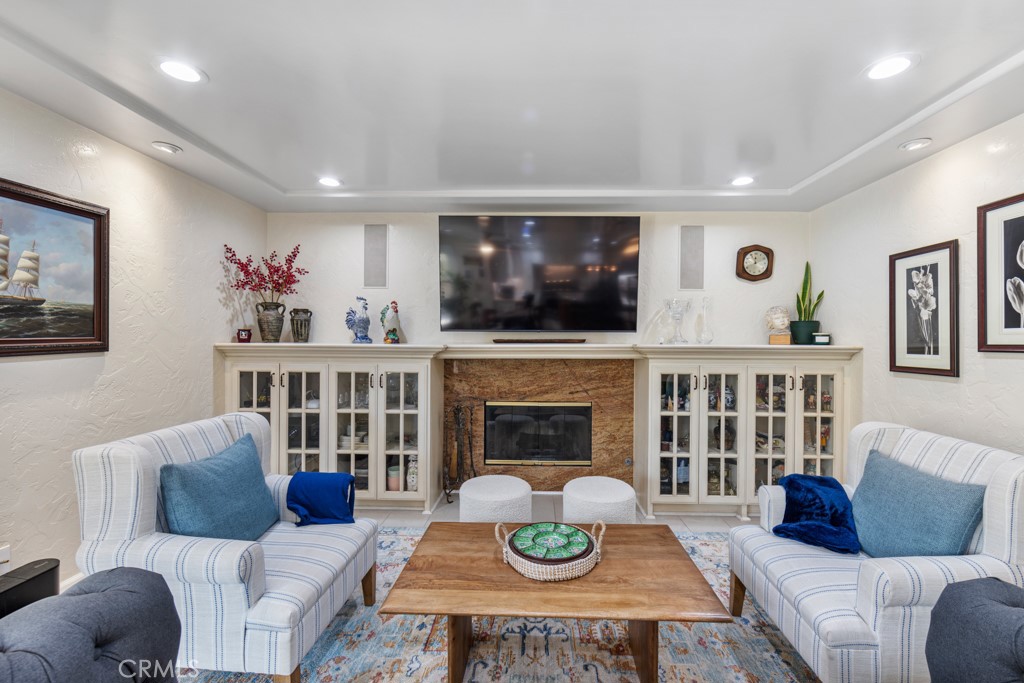 4031 Pine Avenue Long Beach, CA 90807 - Photo 20 of 70 a living room with furniture and a fireplace