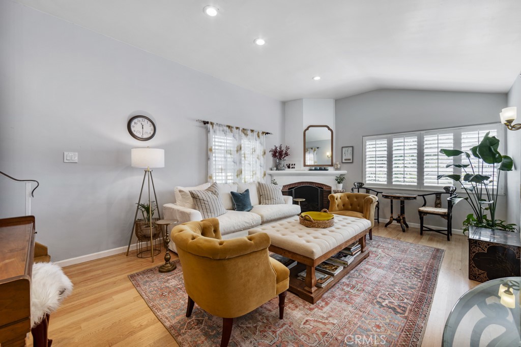 4031 Pine Avenue Long Beach, CA 90807 - Photo 3 of 70 a living room with furniture and a fireplace