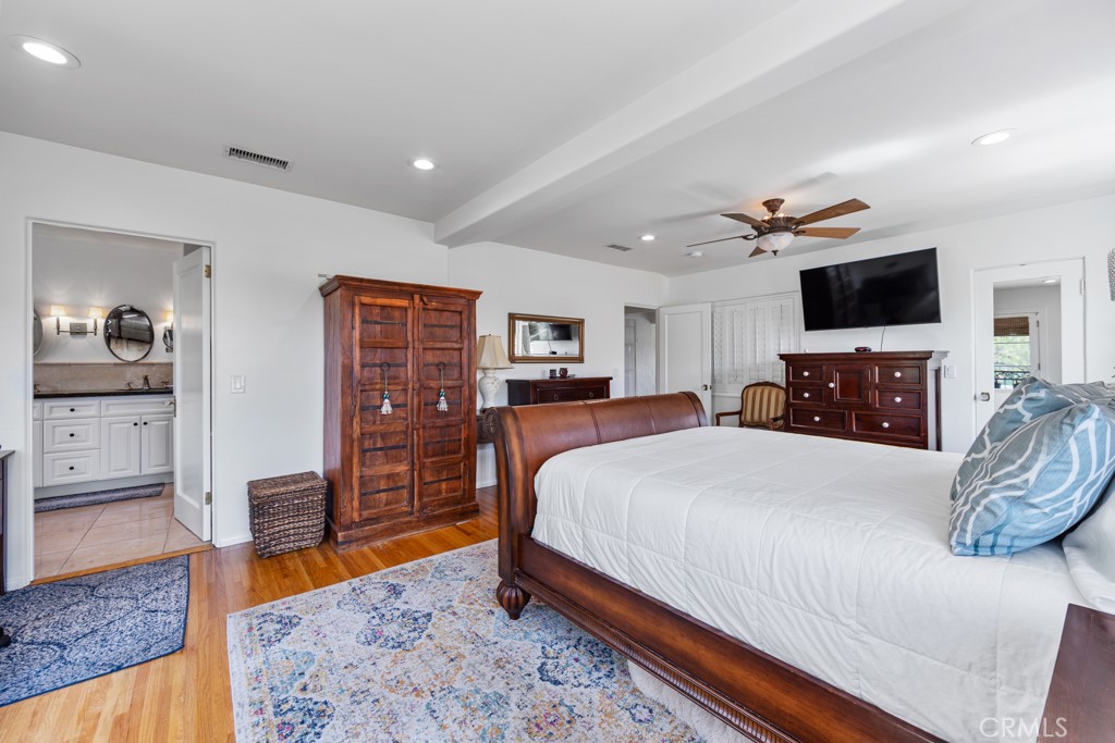 4031 Pine Avenue Long Beach, CA 90807 - Photo 40 of 70 a bed room with a bed a television and dresser