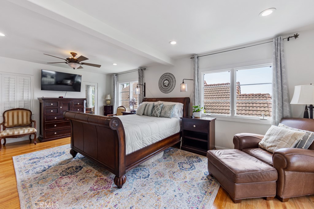 4031 Pine Avenue Long Beach, CA 90807 - Photo 41 of 70 a spacious bedroom with a bed a couch and dresser