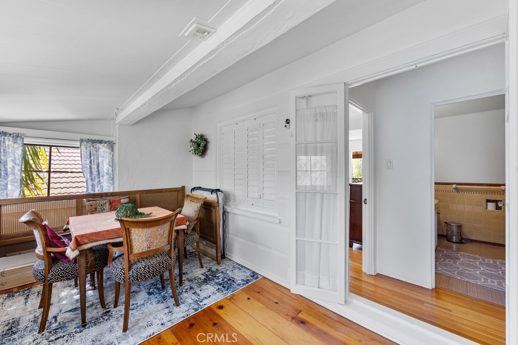 4031 Pine Avenue Long Beach, CA 90807 - Photo 45 of 70 a dining room with furniture and wooden floor