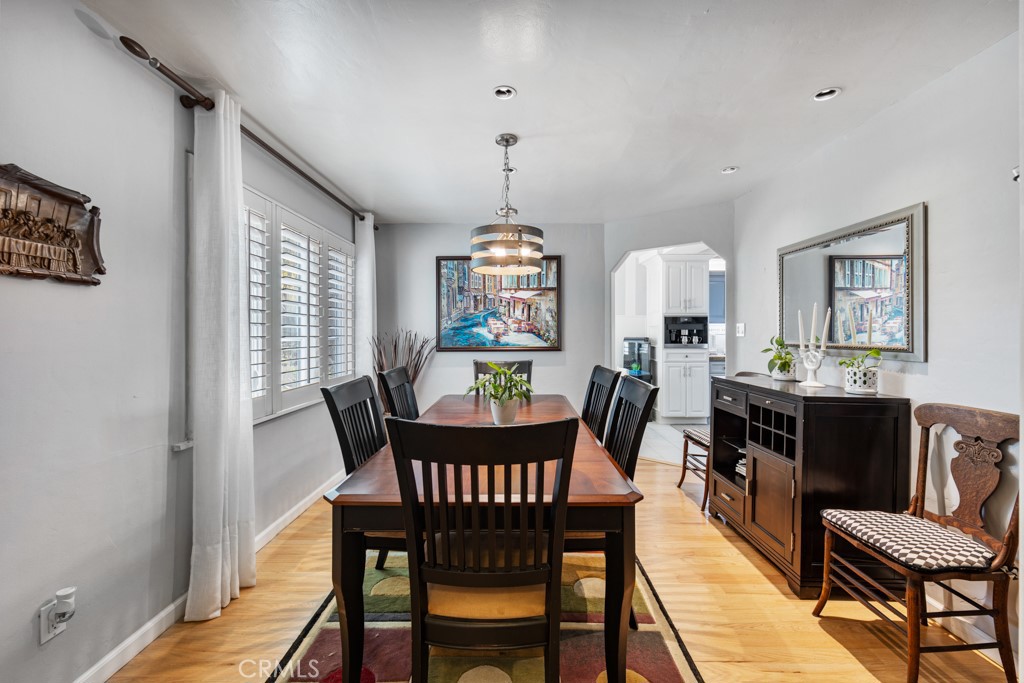 4031 Pine Avenue Long Beach, CA 90807 - Photo 8 of 70 a view of a dining room with furniture window and wooden floor