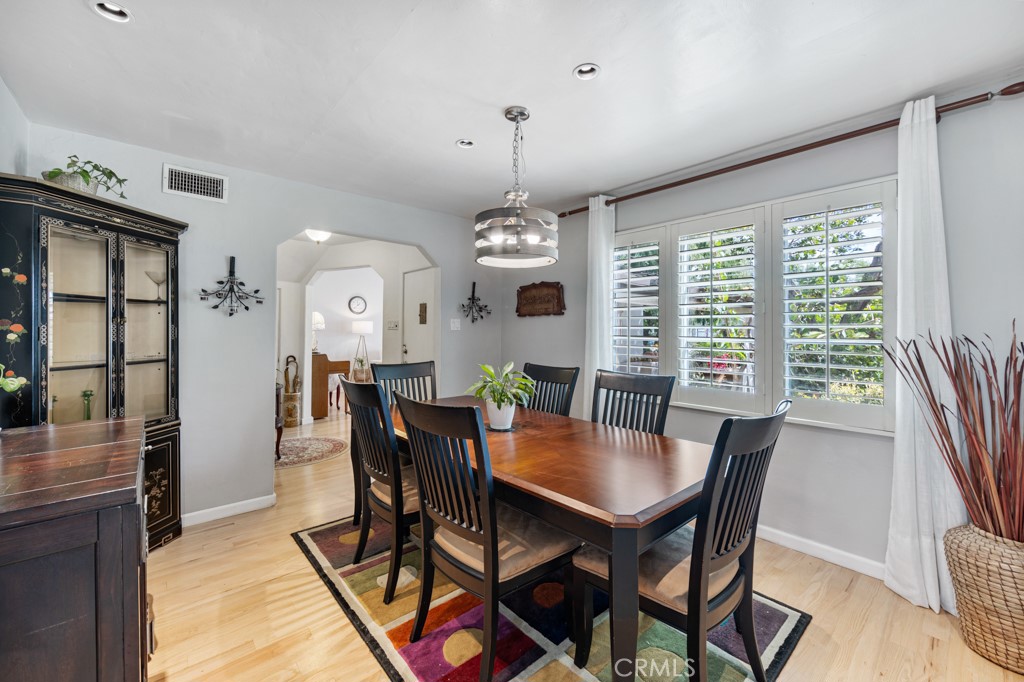 4031 Pine Avenue Long Beach, CA 90807 - Photo 9 of 70 a view of a dining room with furniture window and wooden floor