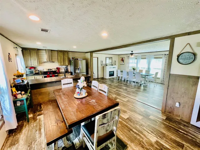a dining room with furniture and a window