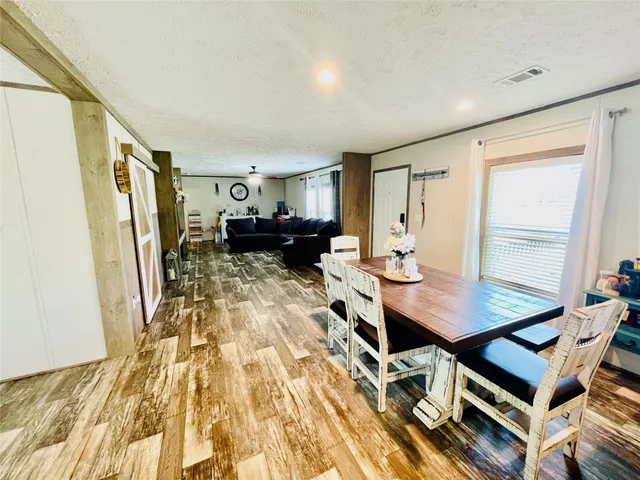 a living room with furniture and a table