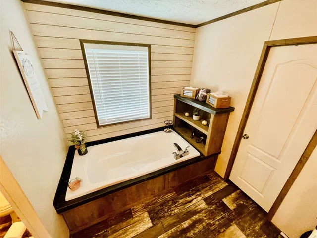 a view of an empty room with windows