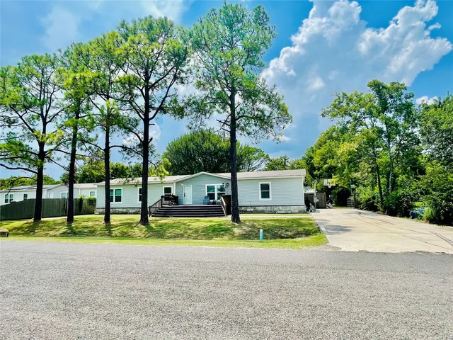 a house with trees in front of it