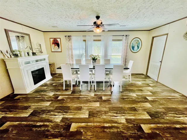 a living room with fireplace furniture and a table