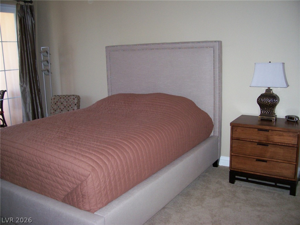 6 Via Vasari, Unit 104 Henderson, NV 89011 - Photo 6 of 13 Bedroom featuring carpet flooring