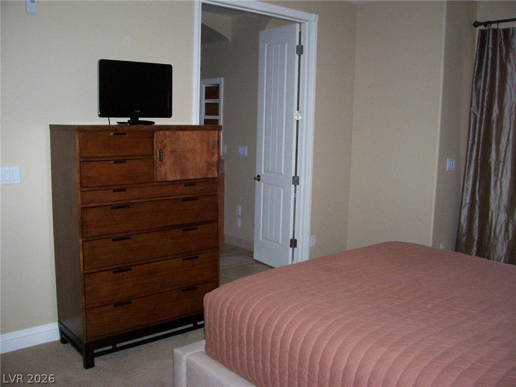 6 Via Vasari, Unit 104 Henderson, NV 89011 - Photo 7 of 13 Bedroom with baseboards