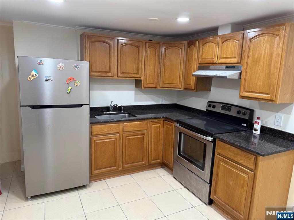 41 Wood Street, Unit 2 Rutherford, NJ 07070 - Photo 3 of 9 a kitchen with a refrigerator sink and cabinets