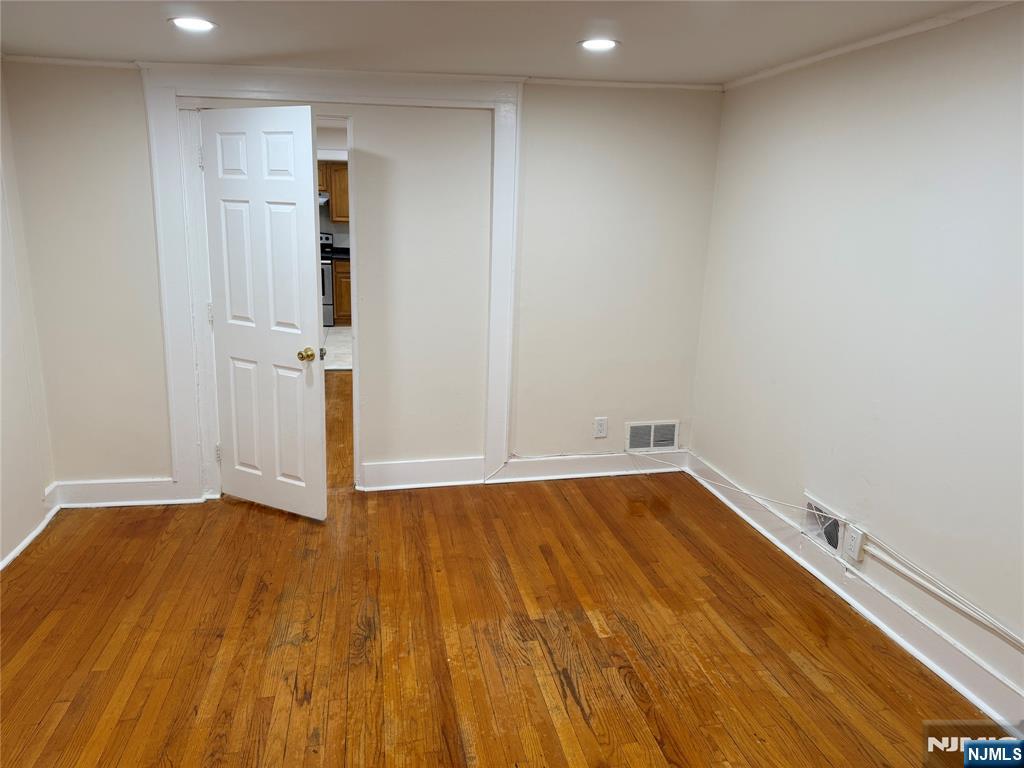 41 Wood Street, Unit 2 Rutherford, NJ 07070 - Photo 8 of 9 a view of an empty room with wooden floor
