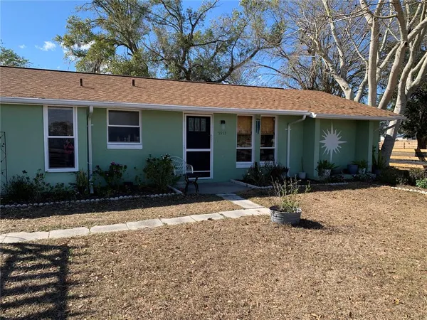 front view of a house with a patio
